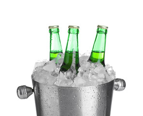 Beer in metal bucket with ice isolated on white