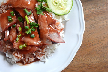 Barbecued red pork in sauce with rice, thai food