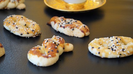 Turkish coffee and traditional cookies - kurabye on a black background