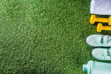 Summer sport, fitness, active lifestyle concept. Pastel sneakers, shaker for cocktail or water,...