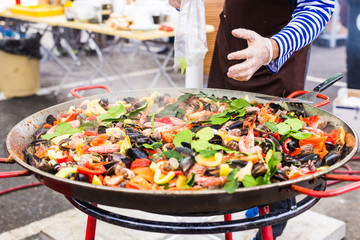 Spanish paella prepared in the street restaurant.