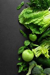 Healthy food, fresh raw green organic fruits and leafy vegetables, clean eating, vegetarian food concept background, top view