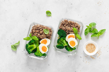 Lunch boxes with broccoli, quinoa and egg, healthy  food, balanced eating concept, top view