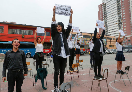 Students take part in a protest with placards that read: "For a free education, the rebellion is justified", and try to boycott the university admissions test, that they accuse of inequality and elitism in Valparaiso