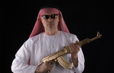 man with a golden assault rifle AK-47