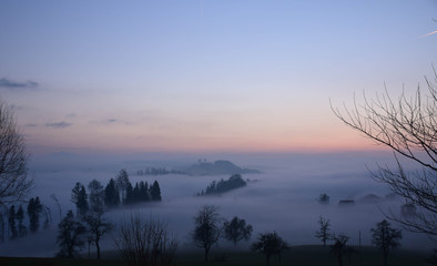 Great view of the foggy Val landscape near Zuerich, Switzerland.