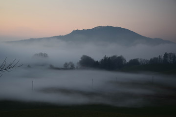 Great view of the foggy Val landscape near Zuerich, Switzerland.