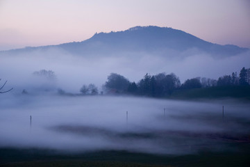 Great view of the foggy Val landscape near Zuerich, Switzerland.