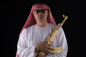 Naklejka premium man with a golden assault rifle AK-47