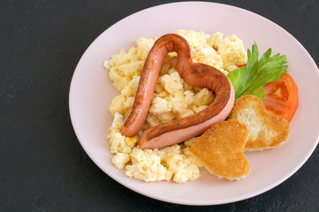 sausages and tomatoes in the shape of a heart for Valentine's day