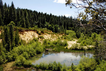 Eroded bluffs remain after 150 years of natural recovery  from hydraulic mining scares, Sierra...