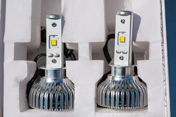 Light bulbs for car lamps. Automotive part in Silvery metallic and black color with wires and connecting elements