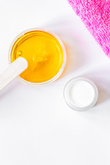 concept depilation with wax on white background top view