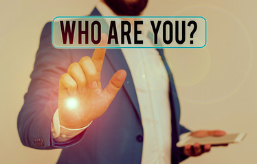 Conceptual hand writing showing Who Are You Question. Concept meaning asking about someone identity...
