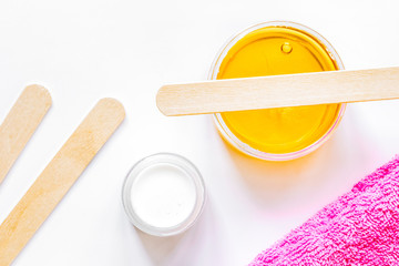 concept depilation with wax on white background top view