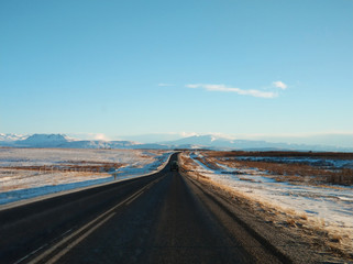 Picturesque winter landscape of Iceland. The perfect road to perspective