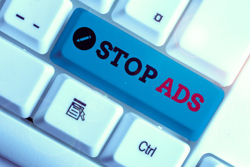 Conceptual hand writing showing Stop Ads. Concept meaning program that will remove different kinds...