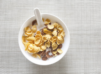 Cereal corn flakes with milk in bowl