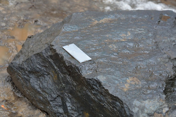 Untreated rough natural gray stone in everyday environment