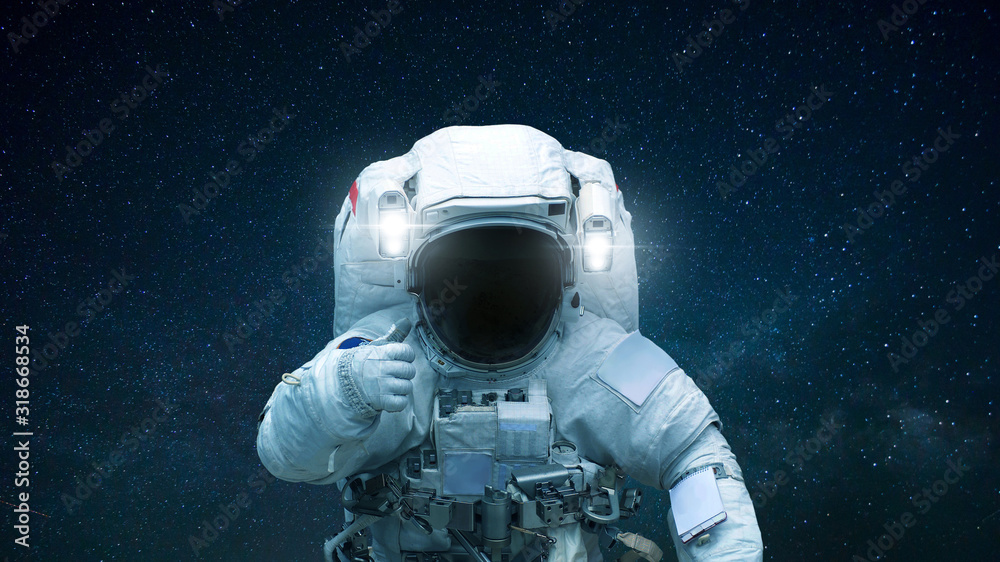 Poster Spaceman in open space with hand shows like. Astronaut travels in space against the background of stars.