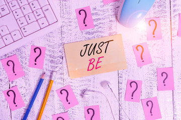 Word writing text Just Be. Business photo showcasing to do the things you believe in and want to be accepted for Writing tools, computer stuff and scribbled paper on top of wooden table