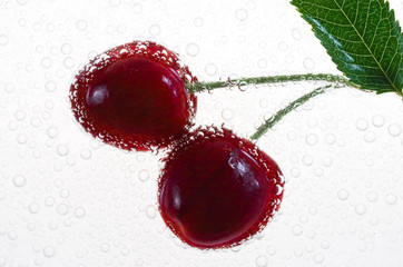 cherry with waterdrops on white background