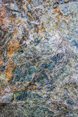 Amazind multicolored background texture of natural rock stone. Vertical oriental photo.