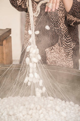 boiling silkworm cocoons to produce silk rope