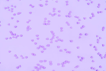 Lilac background with tiny hearts. Valentine's day concept. Top view.
