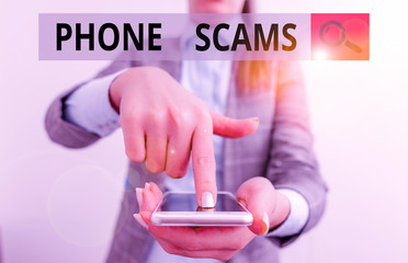 Writing note showing Phone Scams. Business concept for use of telecommunications for illegally...