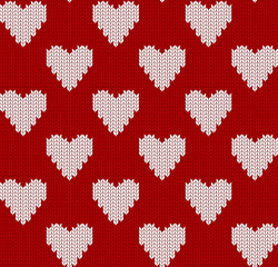 Knitted seamless pattern with hearts. Red background for valentines day