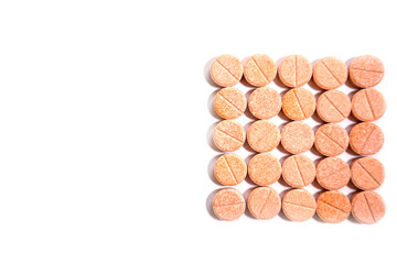 Vitamins pills or medicine on a white background