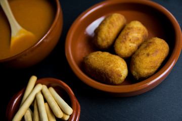 Cold tomato soup, fresh homemade croquettes and breadsticks. Spanish gastronomy