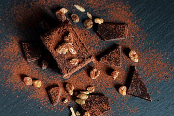 chocolate brownie, nuts chocolate pieces on aerial view