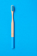 Toothbrush on blue background top view
