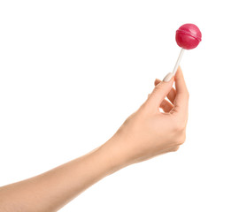 Female hand with sweet lollipop on white background