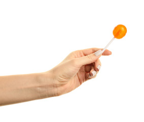 Female hand with sweet lollipop on white background