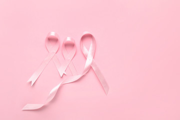 Pink ribbons on color background. Breast cancer awareness concept