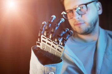 man Controls Electronic Prosthetic Arm Using Bionics Technology Cyber Hand, Robotic Arm Showing
