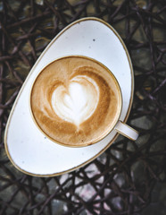 Cup of latte on glass table. Latte Art. 