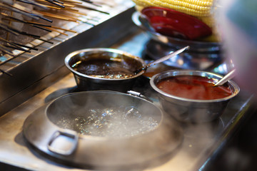 Spicy snack sauces in metal bowls. Asian cuisine