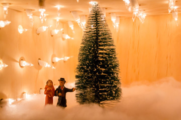 Miniature Christmas Scene. Toy Christmas Tree and Villagers. Vintage Christmas Feel. Holiday Spirit. Fake Snow.