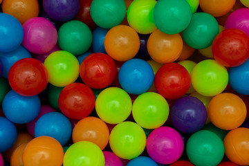 Plastic multi-colored balls for a dry pool. A lot of bright colors. Kids toys. place for text.