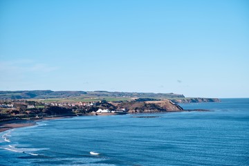 Scarborough coast under a clear blue sky during daytime - Powered by Adobe