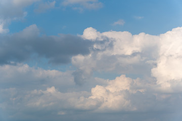 Fototapeta na wymiar Blue sky full of fluffy clouds, shot at bright sunny summer day