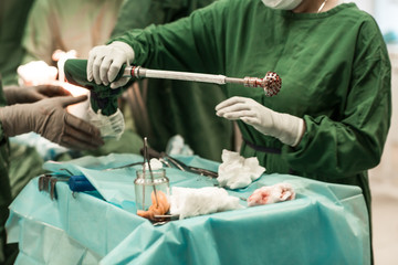 Medical Team Performing Surgical Operation in Modern Operating Room. total hip arthroplasty with...