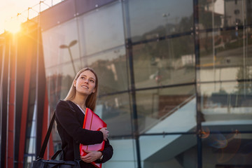 Fototapeta premium Happy successful young businesswoman outdoors.