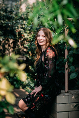 Smiling woman in the botanic garden
