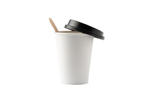 White disposable paper coffee cup with wood stick and a black plastic lid isolated on white background