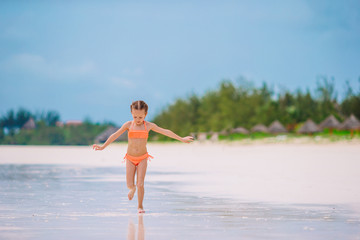 Fototapeta premium Portrait of beautiful girl on the beach dancing